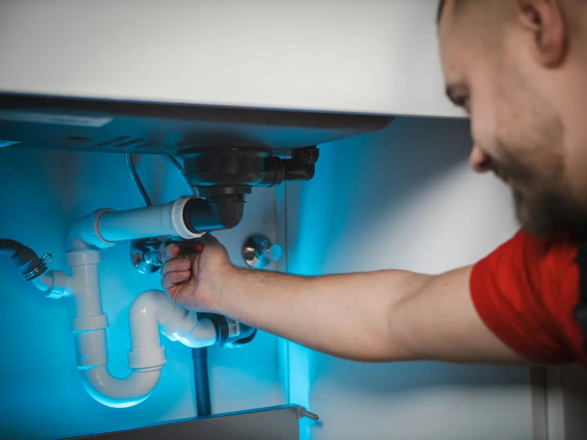 Photo: plumber at work / completed bathroom